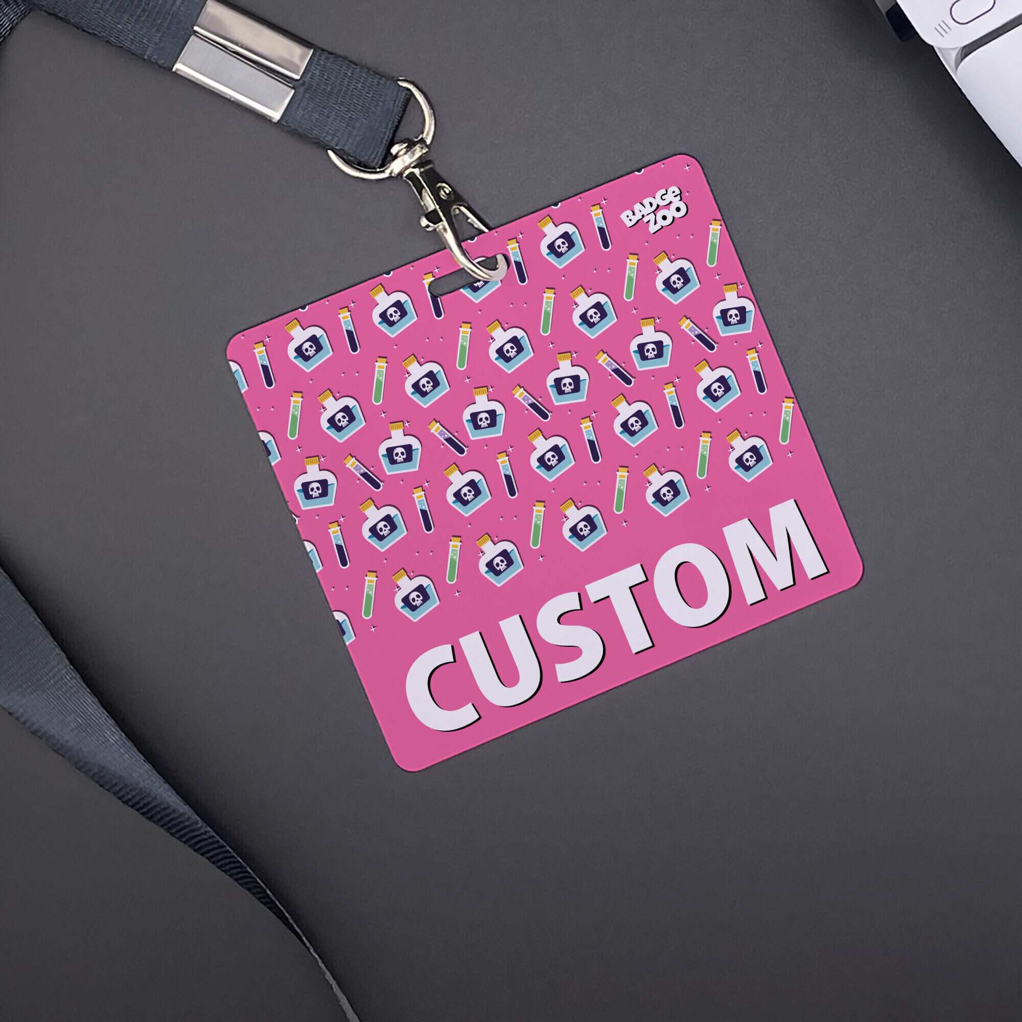 Adorable pink poison bottle badge buddy zoomed in
