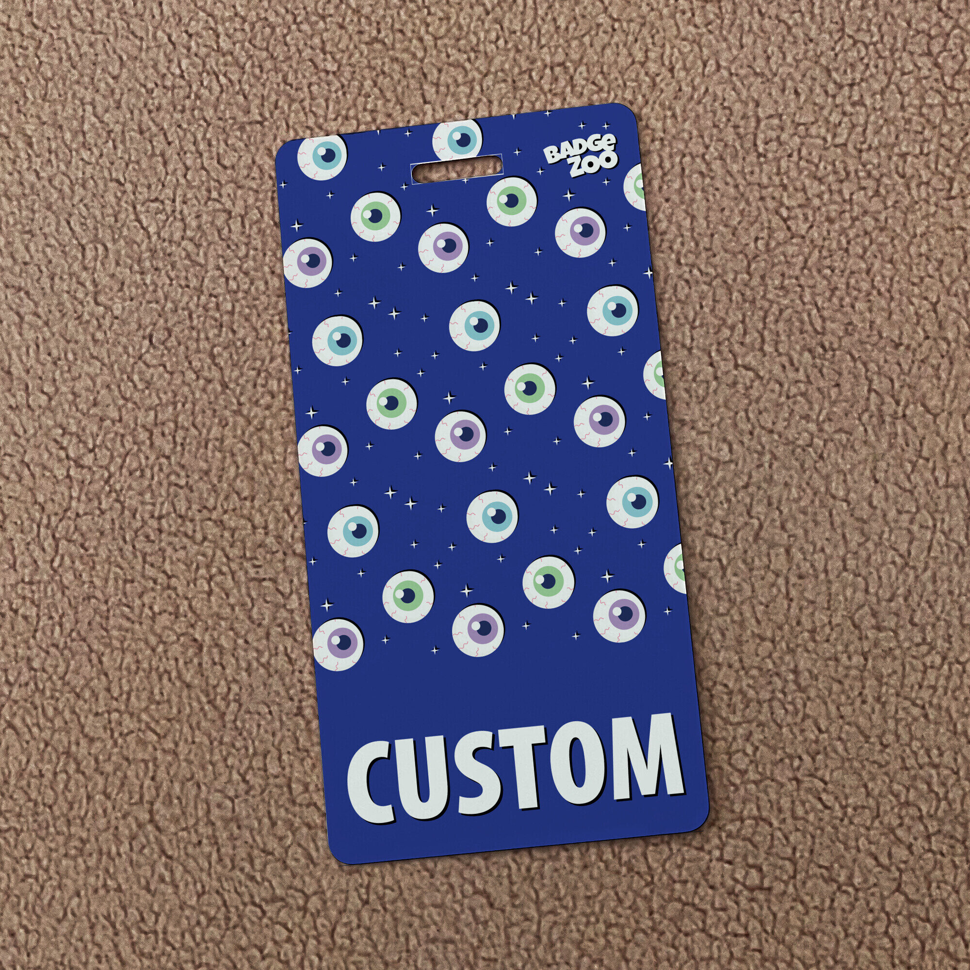 Close-up of detailed eyeball pattern badge buddy