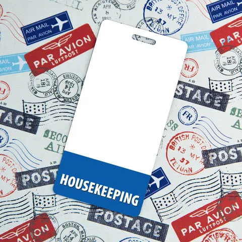 Vertical housekeeping badge buddy on airmail postage stamp fabric with blue HOUSEKEEPING band