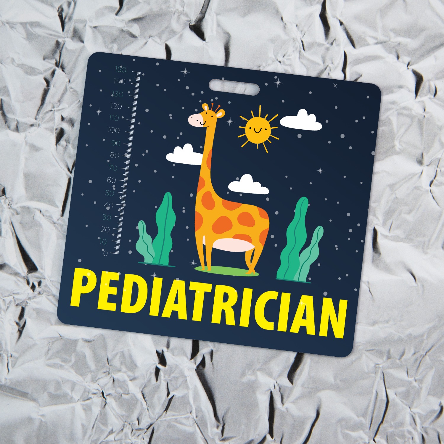 Pediatrician badge buddy with cartoon giraffe under starry navy sky on crinkled aluminum foil background