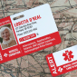 Medical ID card with photo, personal health information, and emergency keychain alert on vintage map background